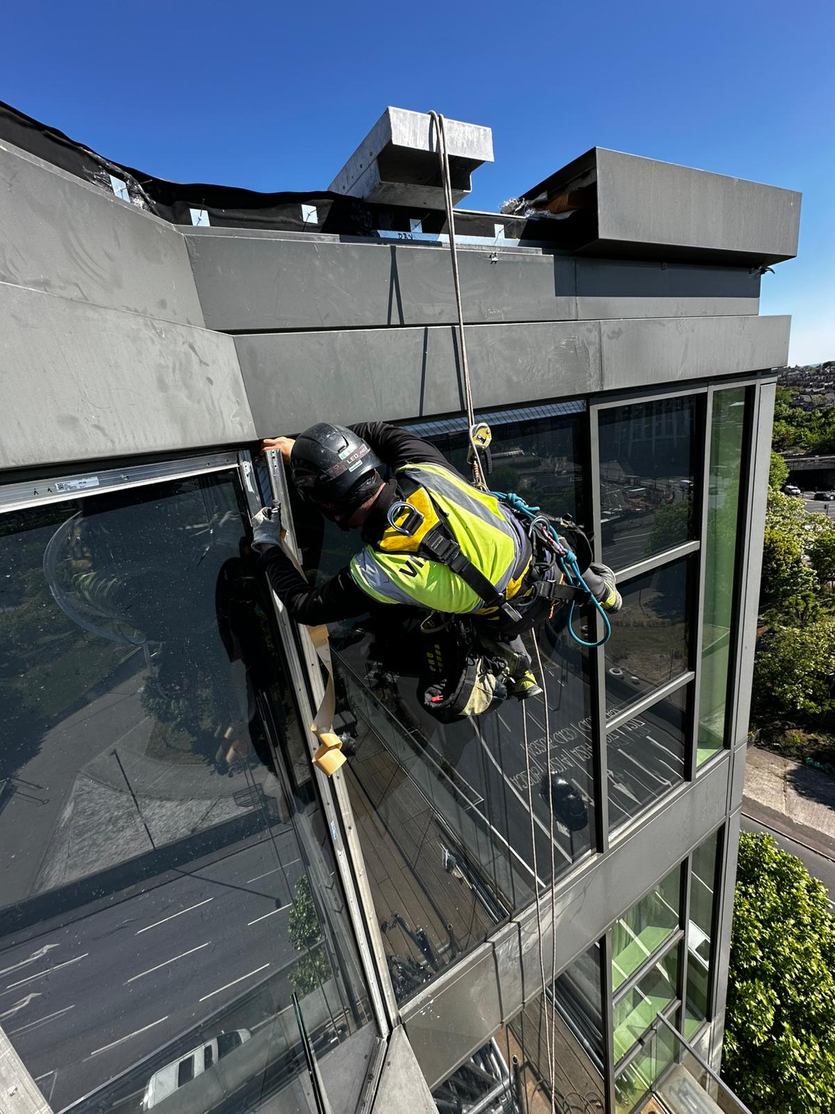 Detailed façade inspection carried out using rope access to assess external building elements.